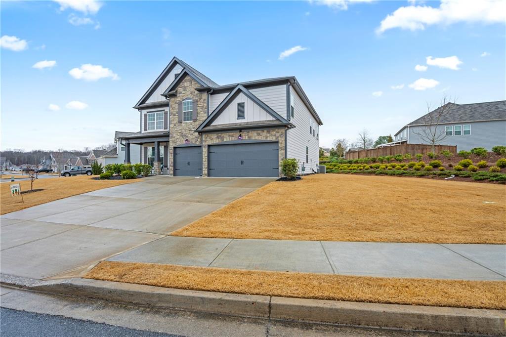6780 Rambling Vale Dawsonville, GA 30534 - Photo 2 of 53 a view of house with outdoor space and sitting area