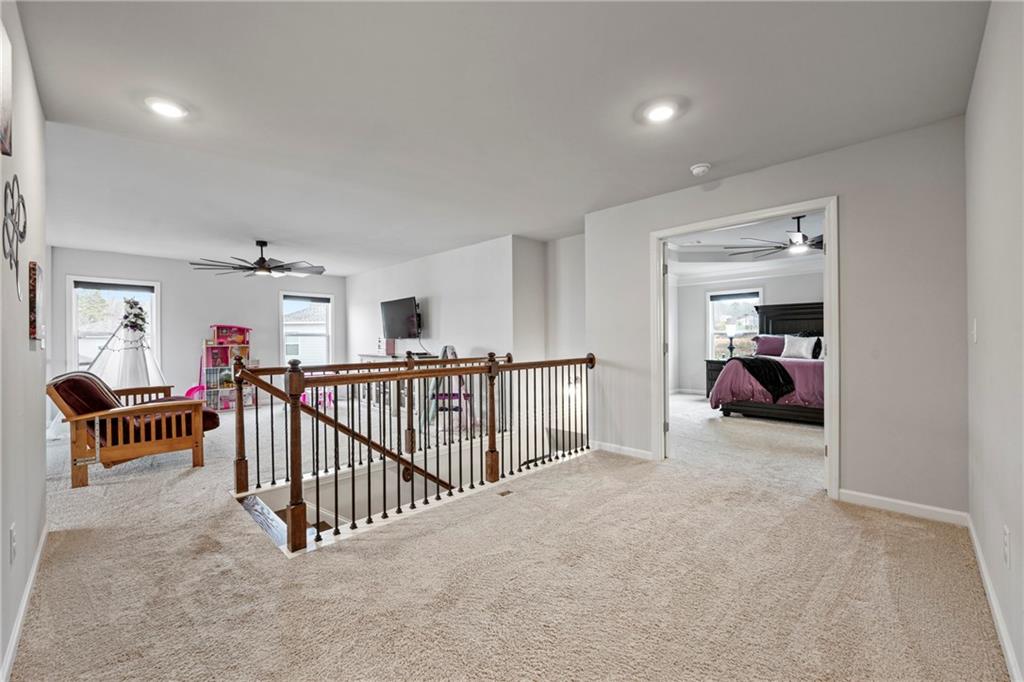 6780 Rambling Vale Dawsonville, GA 30534 - Photo 24 of 53 a view of a bedroom with furniture and a window