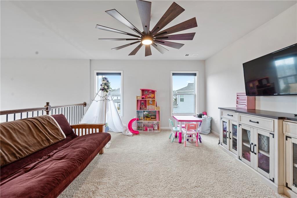 6780 Rambling Vale Dawsonville, GA 30534 - Photo 25 of 53 a living room with furniture and flat screen tv