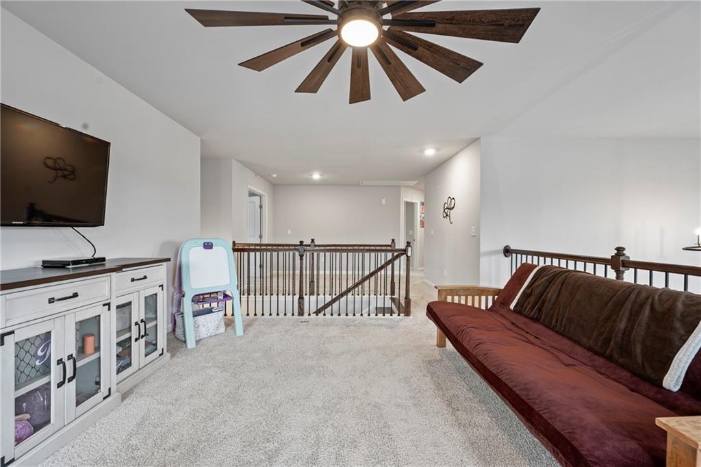 6780 Rambling Vale Dawsonville, GA 30534 - Photo 28 of 53 a living room with furniture and a flat screen tv