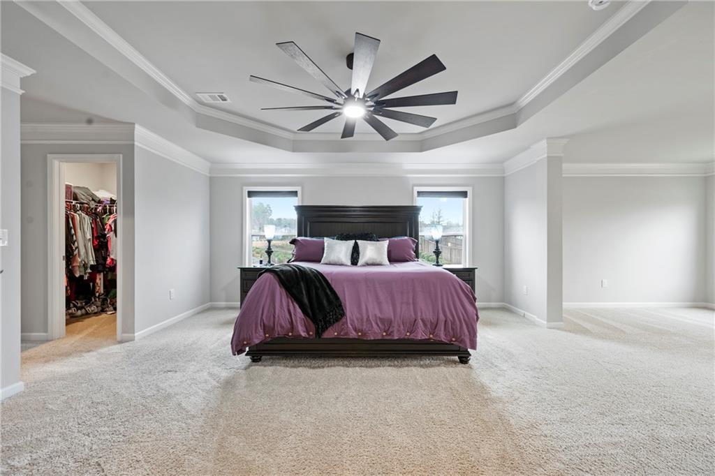 6780 Rambling Vale Dawsonville, GA 30534 - Photo 29 of 53 a bedroom with a bed and ceiling fan