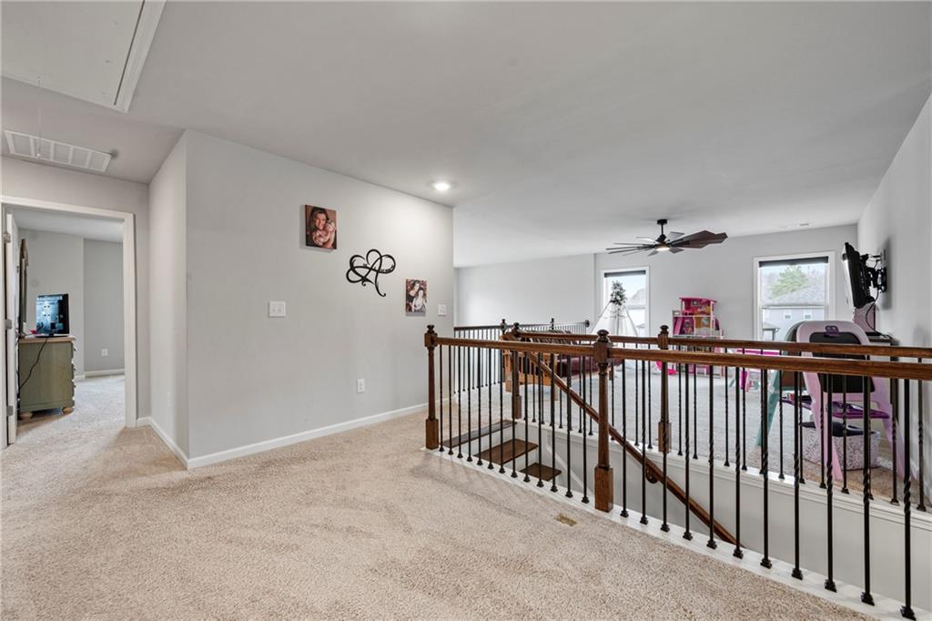 6780 Rambling Vale Dawsonville, GA 30534 - Photo 37 of 53 a view of a hallway with a livingroom
