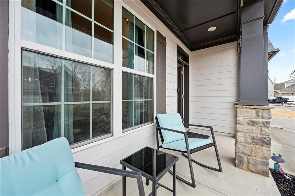 6780 Rambling Vale Dawsonville, GA 30534 - Photo 4 of 53 a view of a chair and table in the balcony