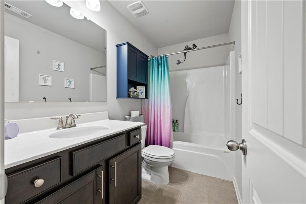 6780 Rambling Vale Dawsonville, GA 30534 - Photo 42 of 53 a bathroom with a sink a toilet a mirror and shower