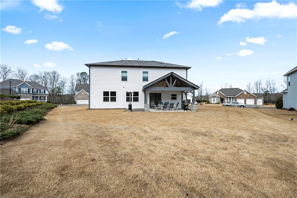 6780 Rambling Vale Dawsonville, GA 30534 - Photo 45 of 53 a front view of a house with a yard