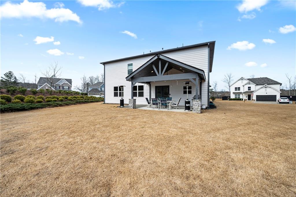 6780 Rambling Vale Dawsonville, GA 30534 - Photo 46 of 53 a front view of a house with a yard