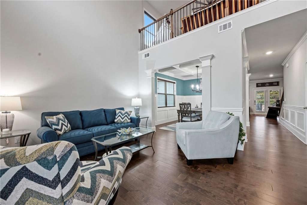 6780 Rambling Vale Dawsonville, GA 30534 - Photo 6 of 53 a living room with couches and a view of kitchen