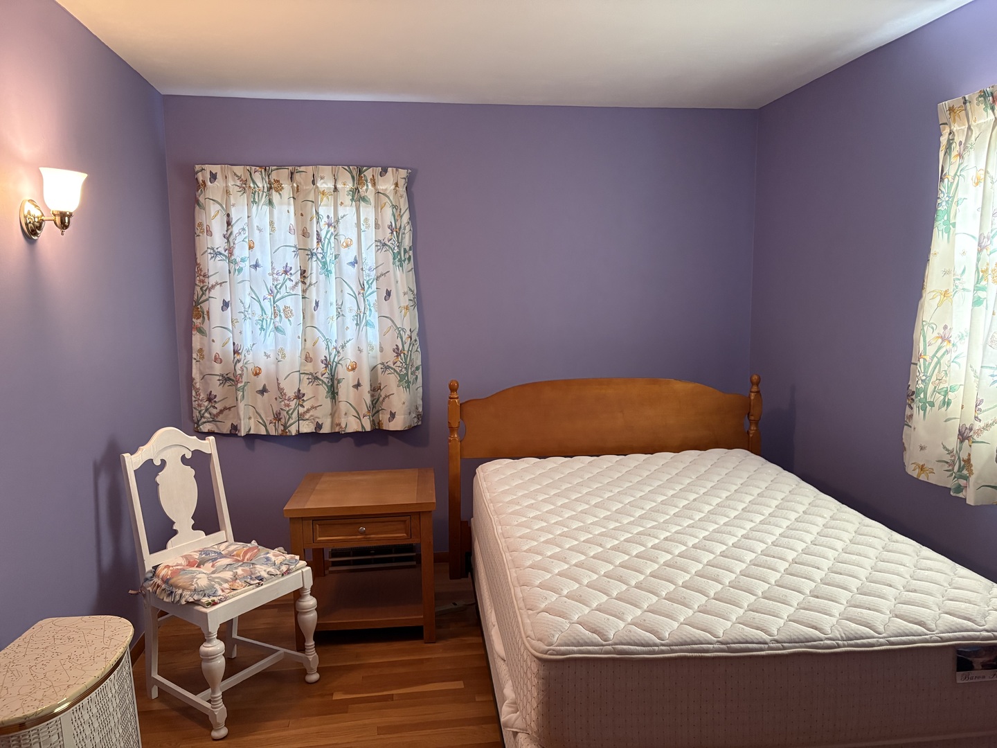 215 Phyllis Avenue Rochelle, IL 61068 - Photo 13 of 27 a bedroom with a bed and a chair