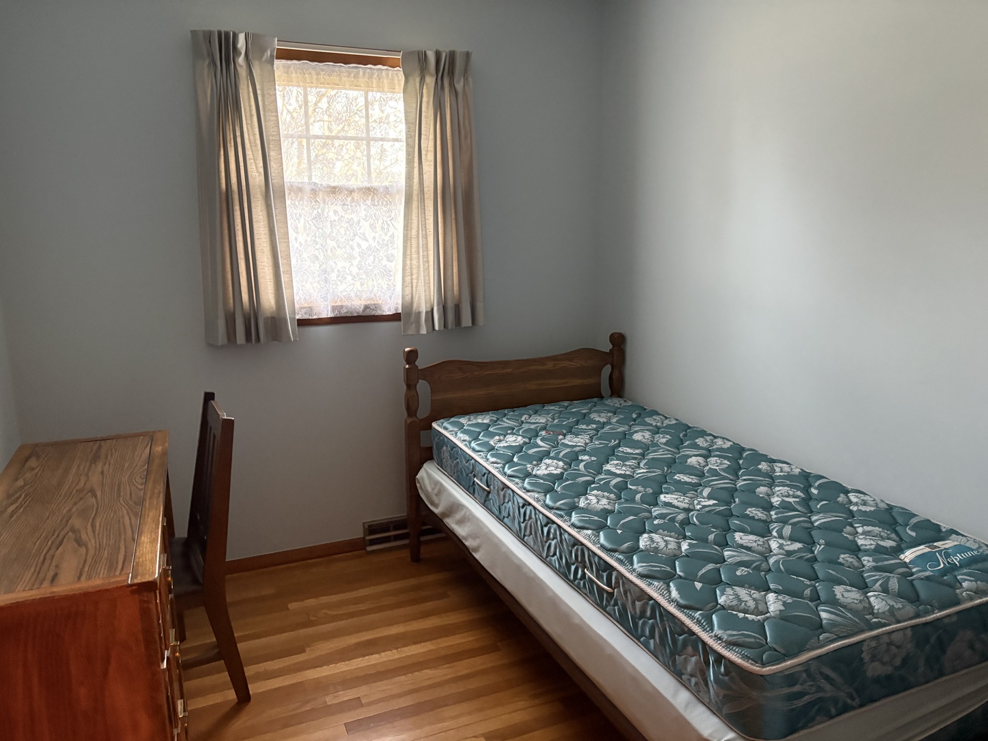 215 Phyllis Avenue Rochelle, IL 61068 - Photo 16 of 27 a bedroom with wooden bed and a window