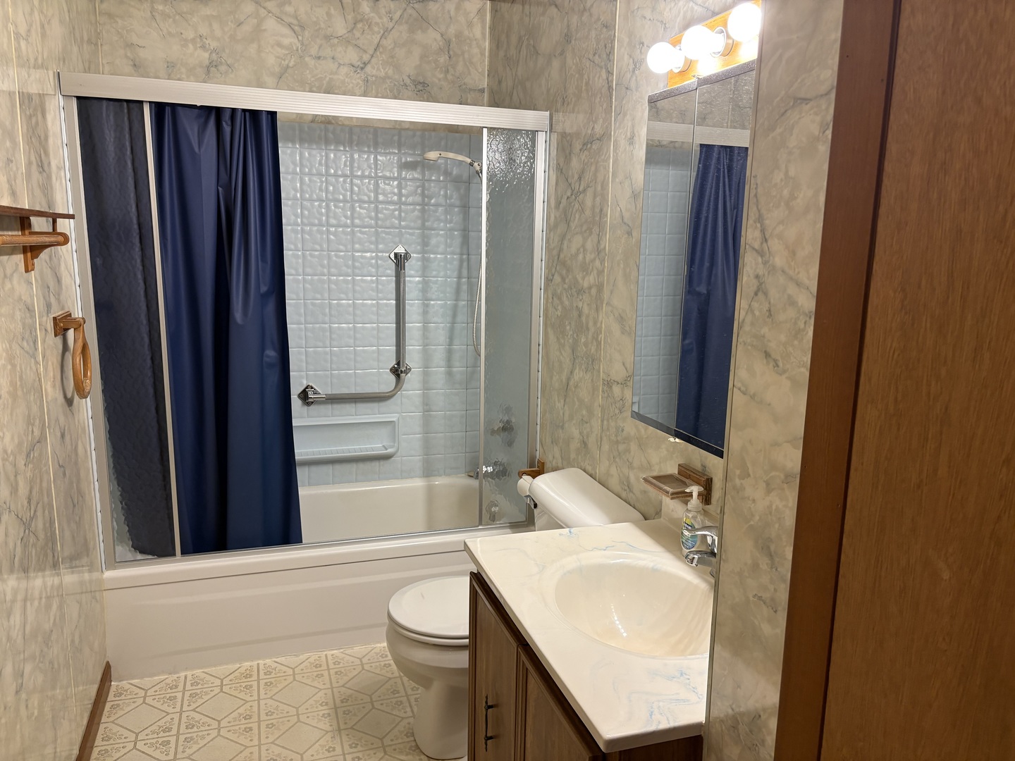 215 Phyllis Avenue Rochelle, IL 61068 - Photo 17 of 27 a bathroom with a sink a toilet and shower