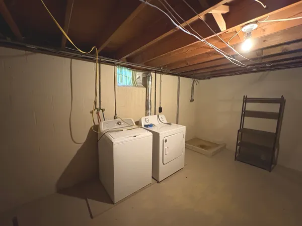 a bathroom with a mirror and shower