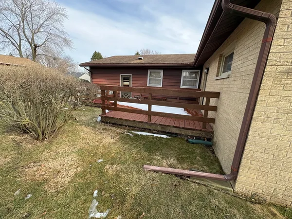 a view of a backyard with wooden floor and lake view