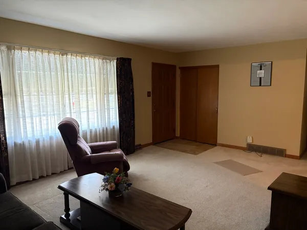 a view of workspace with furniture and window