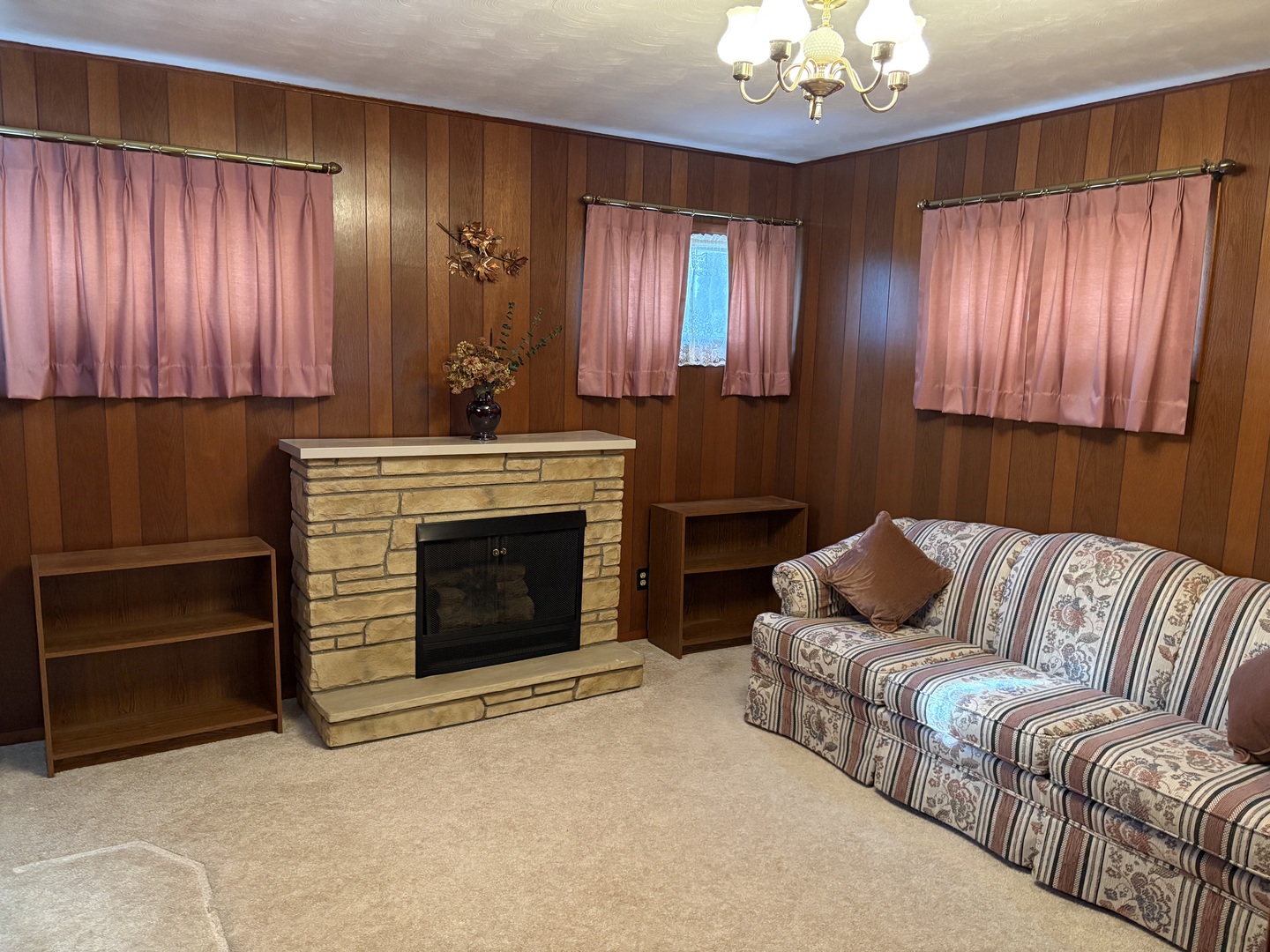 215 Phyllis Avenue Rochelle, IL 61068 - Photo 9 of 27 a living room with furniture and a fireplace