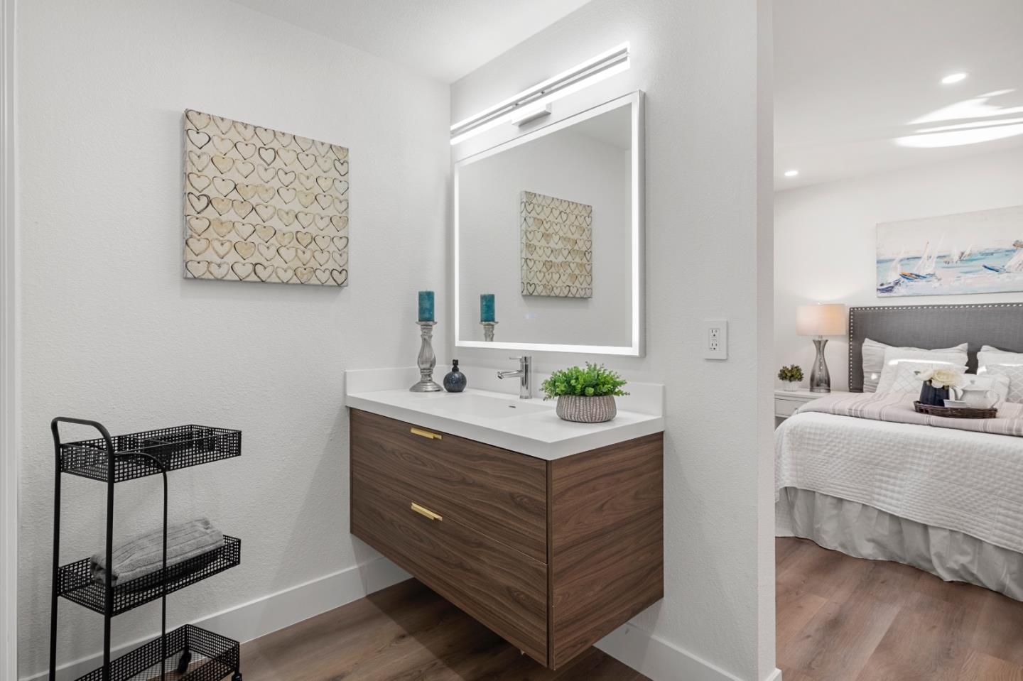 1014 Viewpointe Boulevard Rodeo, CA 94572 - Photo 9 of 20 a room with a bed and a lamp on table