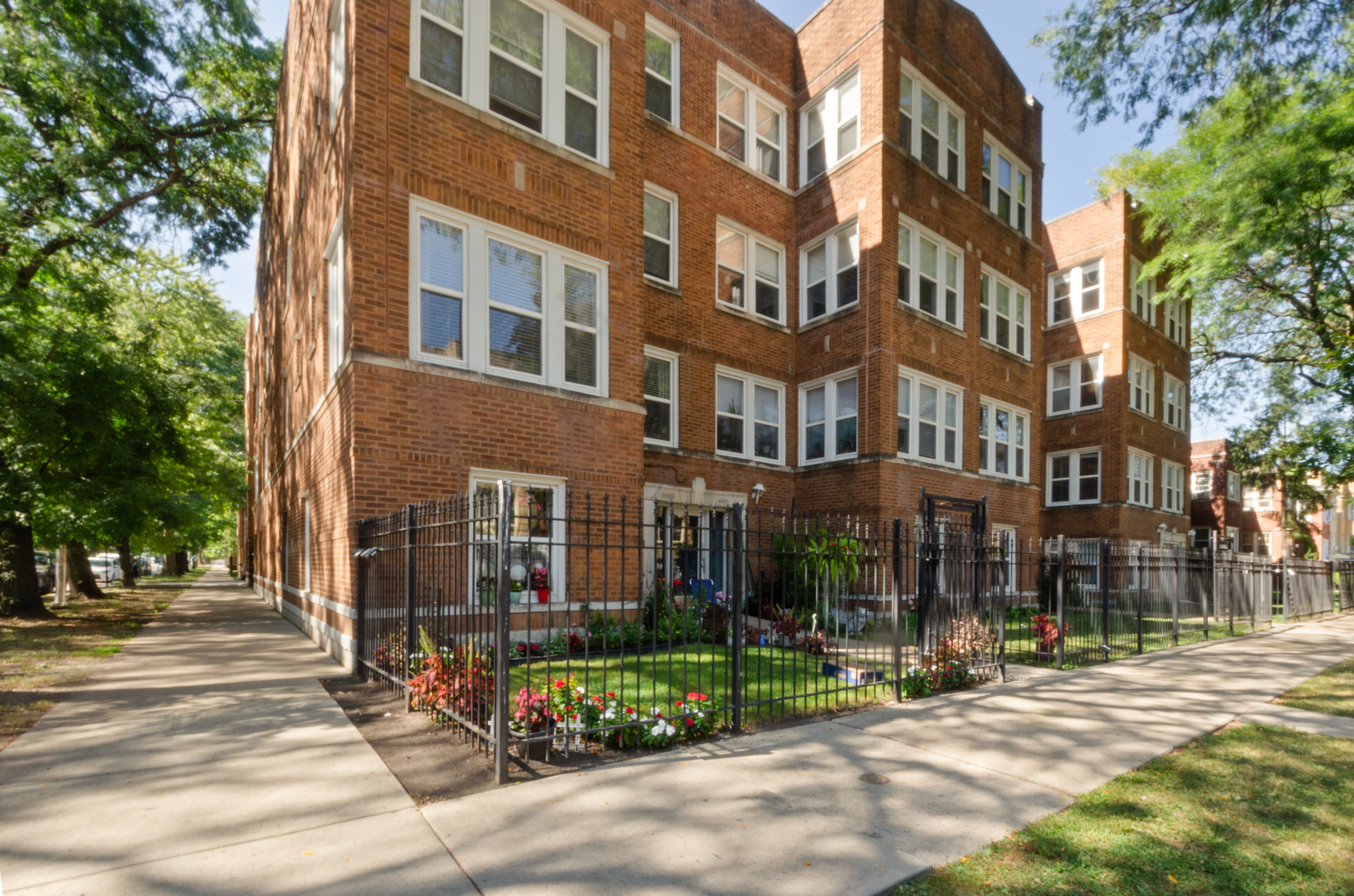 3908 West Ainslie Street, Unit G Chicago, IL 60625 - Photo 1 of 16 a view of buildings with street