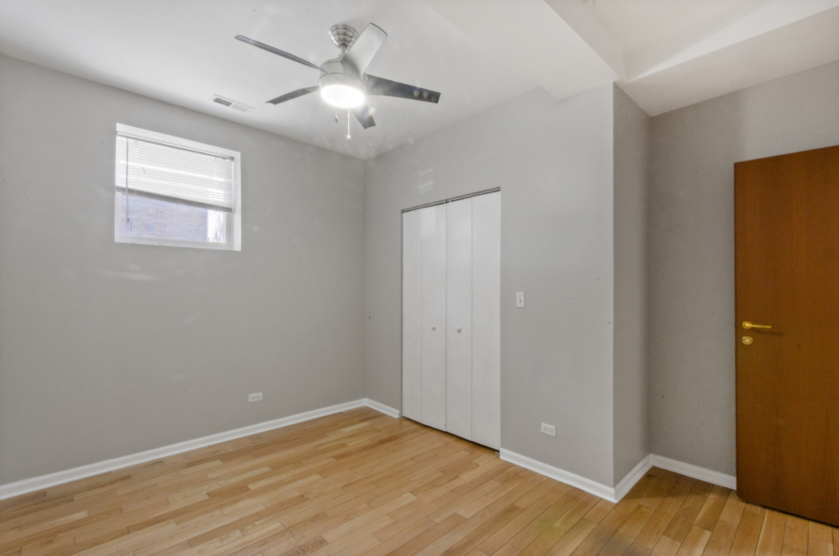 3908 West Ainslie Street, Unit G Chicago, IL 60625 - Photo 10 of 16 a view of an empty room with wooden floor