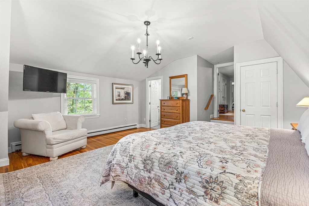 2 Longfellow Road Wellesley, MA 02481 - Photo 11 of 28 a bedroom with a bed and a couch