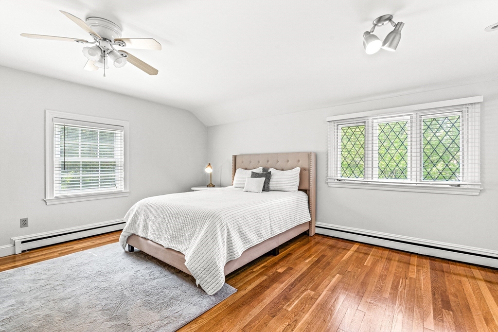 2 Longfellow Road Wellesley, MA 02481 - Photo 15 of 28 a spacious bedroom with a bed and a window