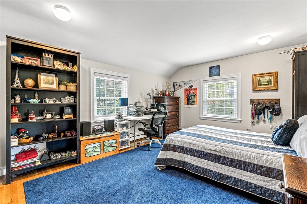2 Longfellow Road Wellesley, MA 02481 - Photo 16 of 28 a bedroom with bed and a book shelf
