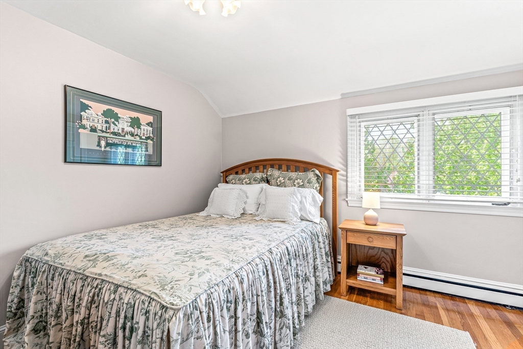 2 Longfellow Road Wellesley, MA 02481 - Photo 17 of 28 a bedroom with a bed a table and a window