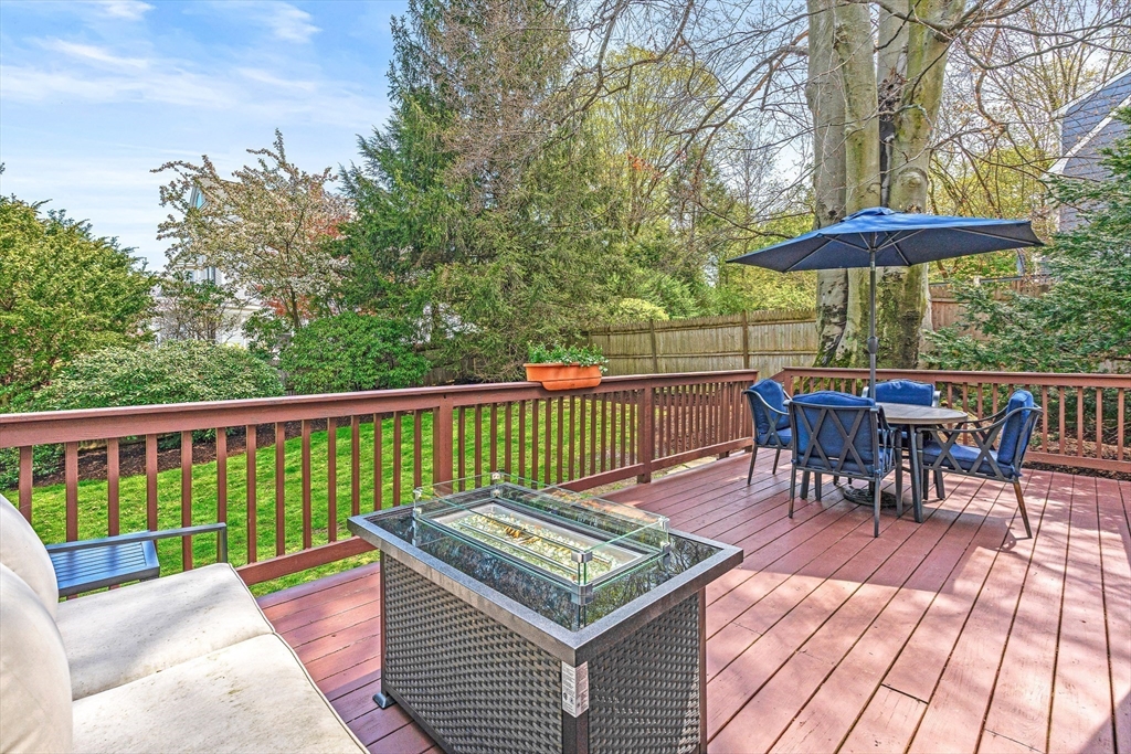 2 Longfellow Road Wellesley, MA 02481 - Photo 23 of 28 a view of a deck with wooden floor and outdoor seating