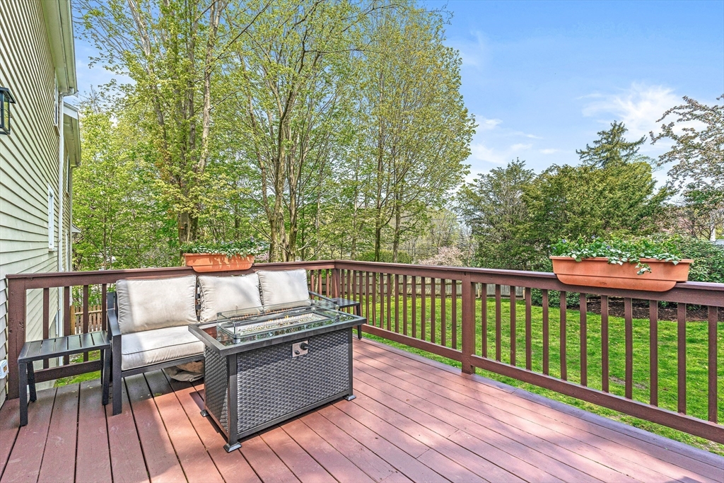 2 Longfellow Road Wellesley, MA 02481 - Photo 24 of 28 a view of a balcony with wooden floor and outdoor seating
