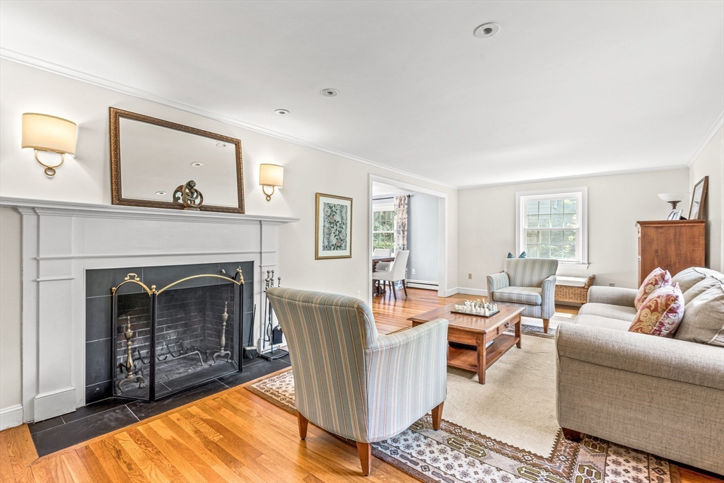 2 Longfellow Road Wellesley, MA 02481 - Photo 3 of 28 a living room with furniture and a fireplace
