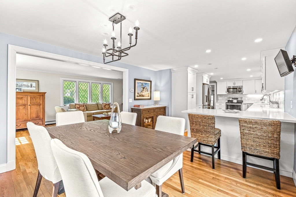 2 Longfellow Road Wellesley, MA 02481 - Photo 4 of 28 a dining room with a table chairs and kitchen view