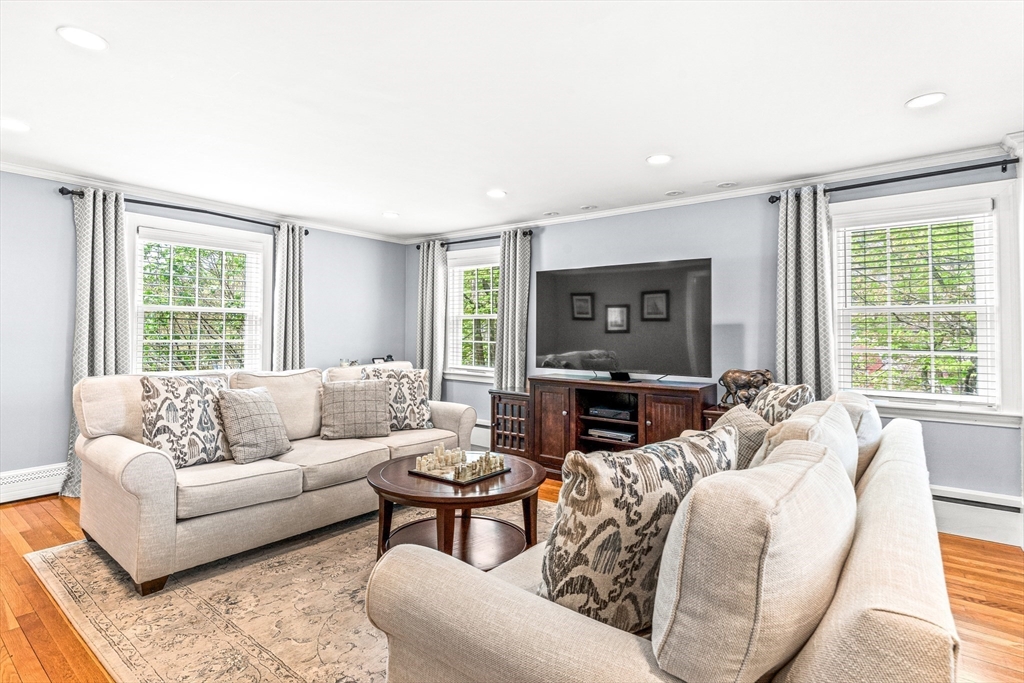 2 Longfellow Road Wellesley, MA 02481 - Photo 9 of 28 a living room with furniture a large window and a flat screen tv