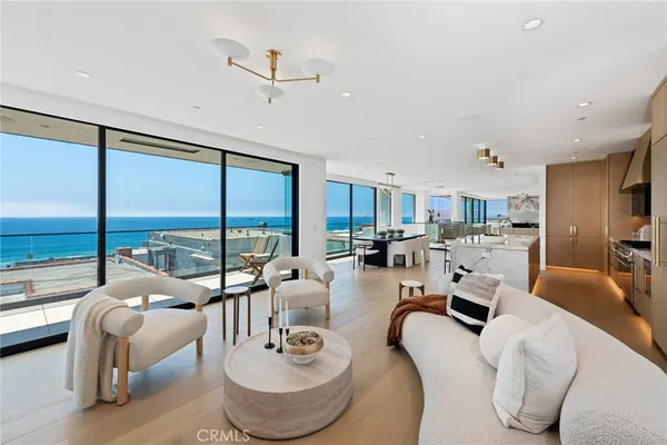 a room with furniture large window and a table