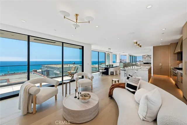 a room with furniture large window and a table