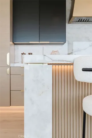 a kitchen with sink stove and cabinets