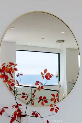 a spacious bathroom with a tub sink and mirror