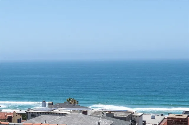 a bathroom with a sink tub double vanity and a mirror