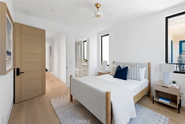 a living room filled with furniture and a large window