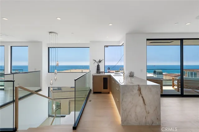 a living room with furniture large window and a flat screen tv