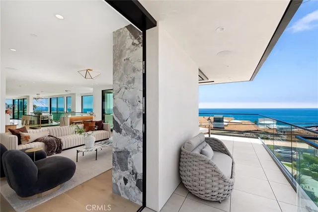 a view of kitchen with kitchen island and a view of living room