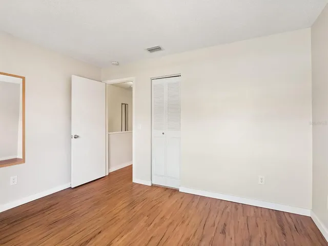 a view of backyard with a table and a chairs