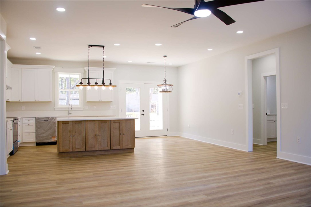 2515 Highway 29 Anderson, SC 29621 - Photo 5 of 38 An open-concept living space presents a well-appointed kitchen island, sleek appliances, and easy patio access.