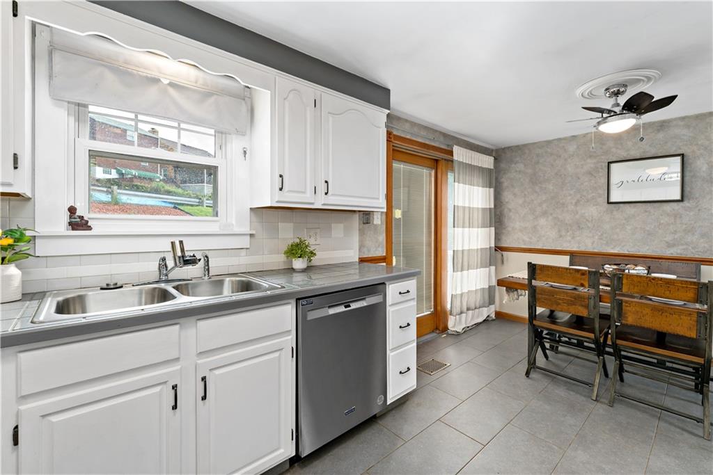 3181 Mellott Road Pittsburgh, PA 15227 - Photo 13 of 34 a kitchen with a sink and cabinets