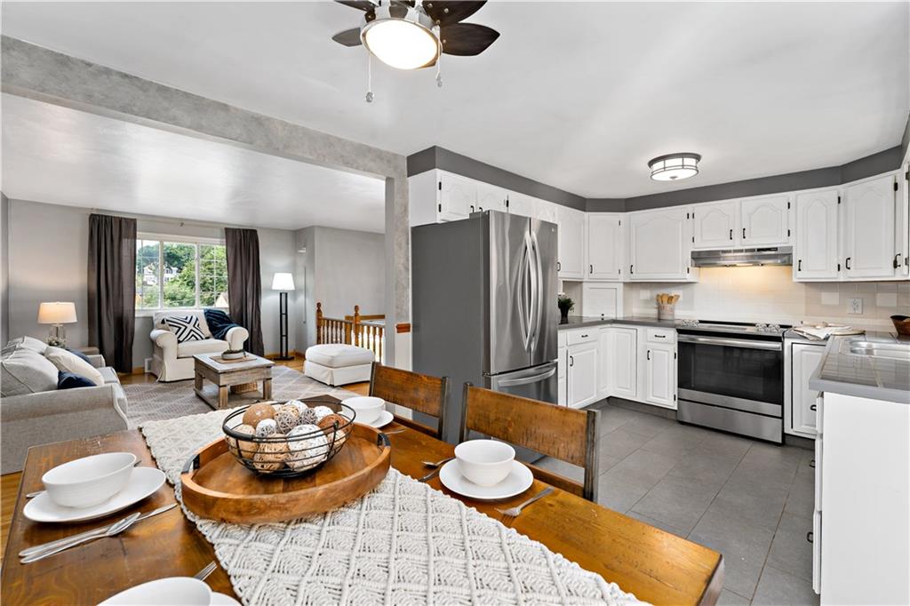 3181 Mellott Road Pittsburgh, PA 15227 - Photo 16 of 34 a kitchen with stainless steel appliances kitchen island granite countertop a sink and a stove