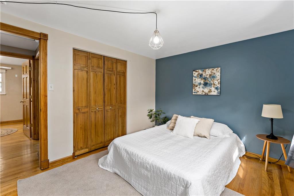 3181 Mellott Road Pittsburgh, PA 15227 - Photo 17 of 34 a bedroom with a bed and a table in it