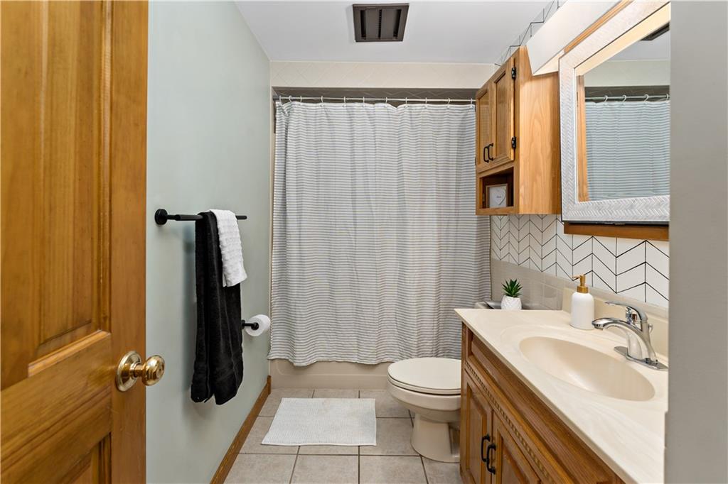 3181 Mellott Road Pittsburgh, PA 15227 - Photo 21 of 34 a bathroom with a sink toilet and shower