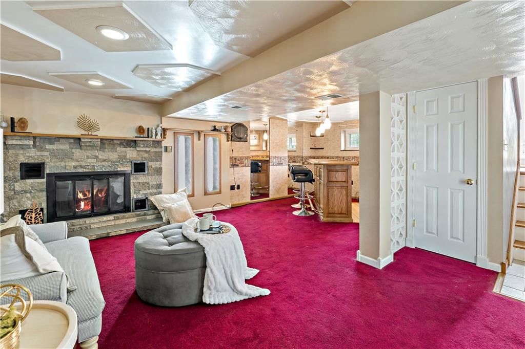 3181 Mellott Road Pittsburgh, PA 15227 - Photo 22 of 34 a living room with furniture and a fireplace