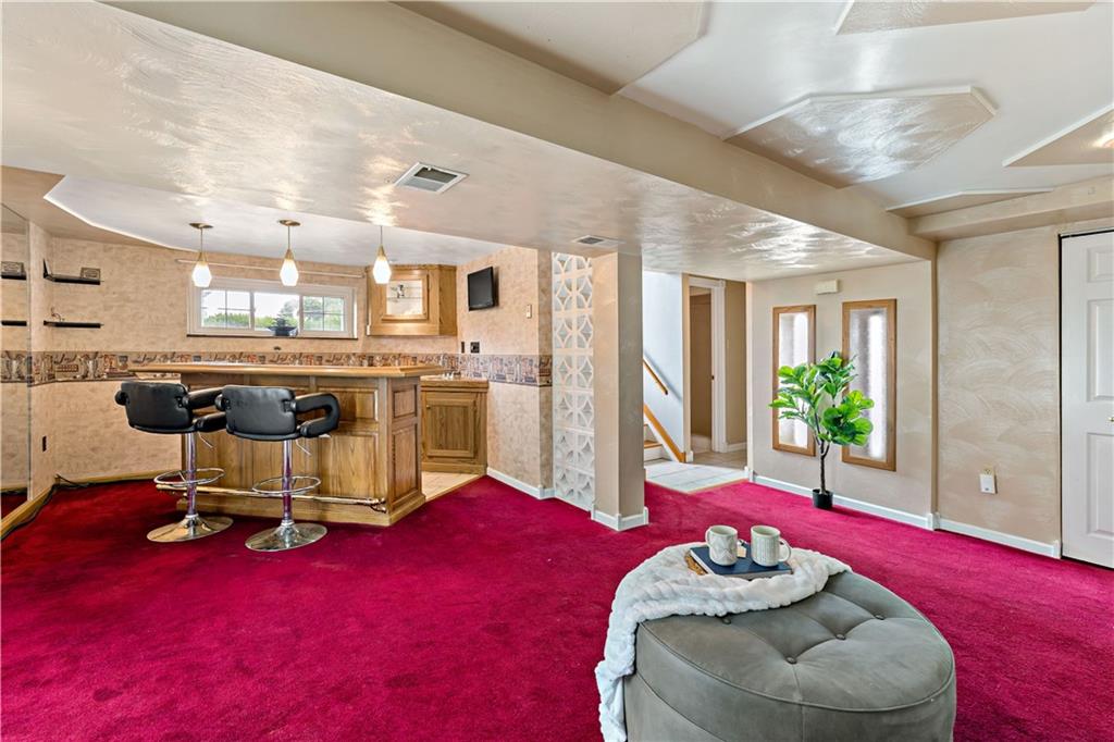 3181 Mellott Road Pittsburgh, PA 15227 - Photo 23 of 34 a living room with furniture and a table