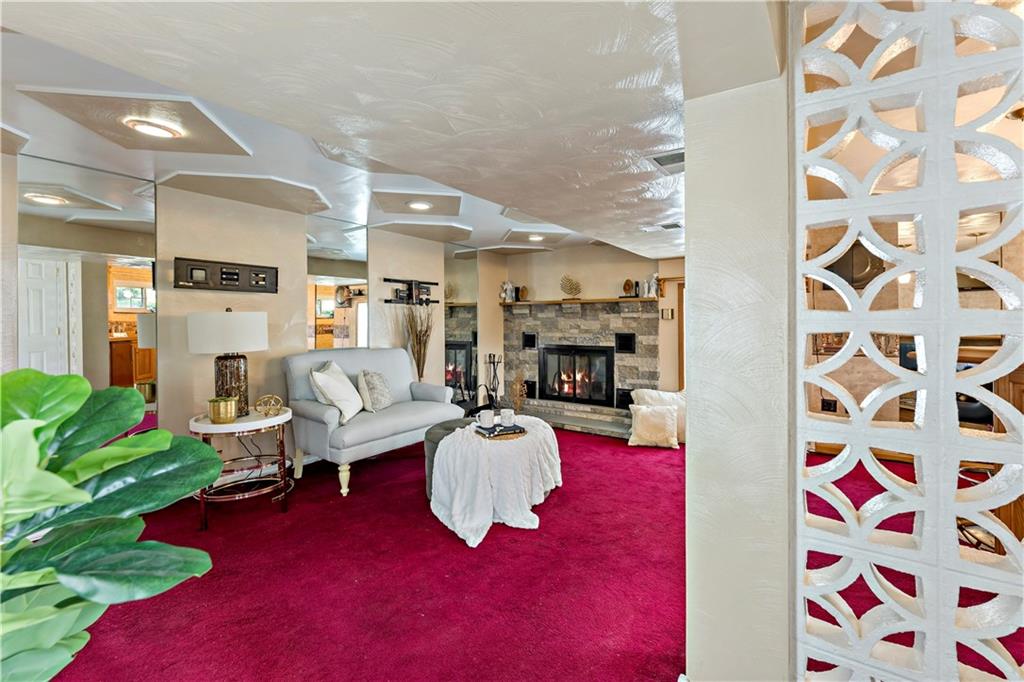 3181 Mellott Road Pittsburgh, PA 15227 - Photo 26 of 34 a living room with furniture fireplace and potted plant