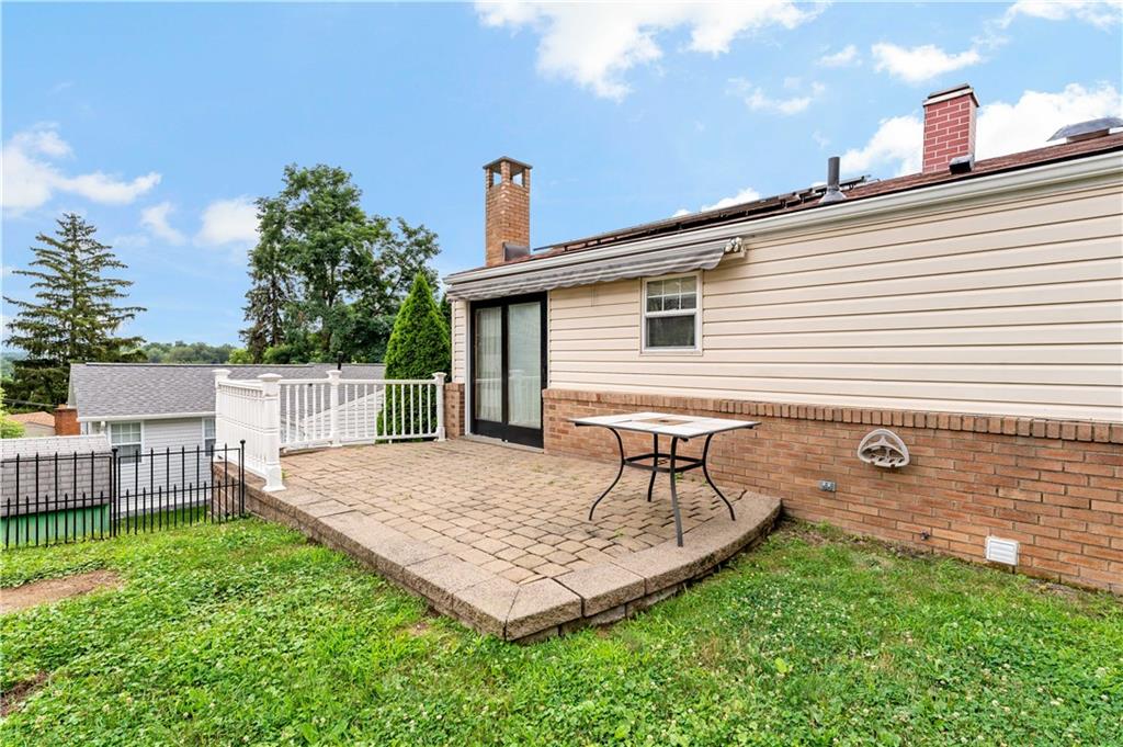 3181 Mellott Road Pittsburgh, PA 15227 - Photo 30 of 34 a view of a backyard with a garden and deck