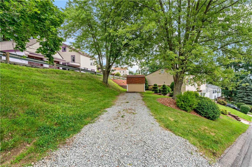 3181 Mellott Road Pittsburgh, PA 15227 - Photo 3 of 34 a front view of a house with garden