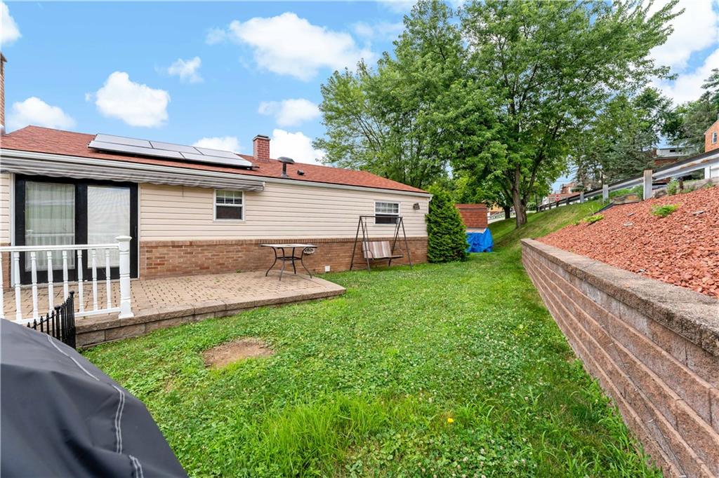 3181 Mellott Road Pittsburgh, PA 15227 - Photo 31 of 34 a front view of a house with garden